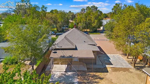 an aerial view of residential houses with outdoor space