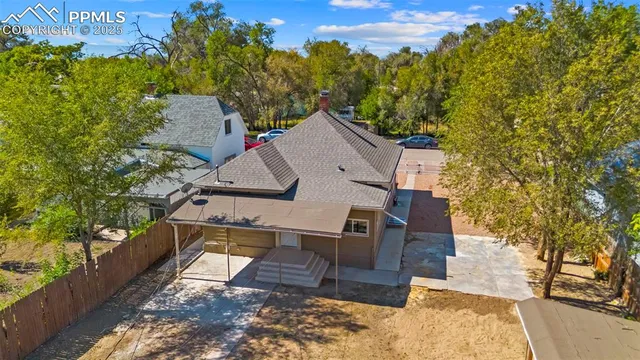 a aerial view of a house with a yard