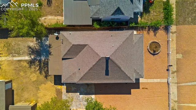 a picture of a bench in front of a wall