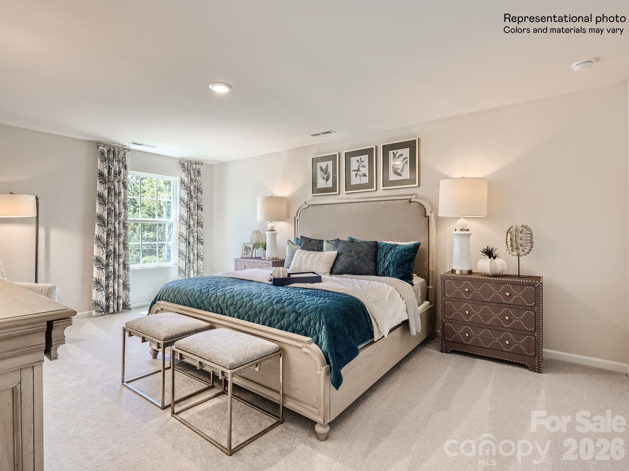 159 Astor Street Troutman, NC 28166 - Photo 16 of 24 a spacious bedroom with a bed and window