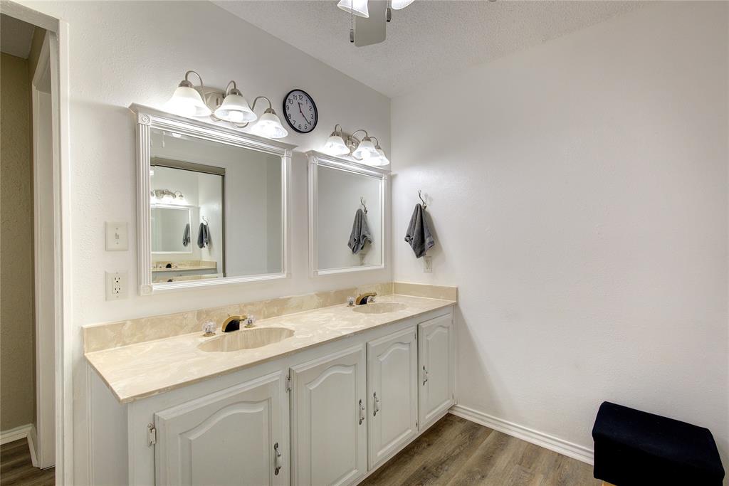 753 County Rd SW 3110 Mount Vernon, TX 75457 - Photo 24 of 40 Primary ensuite bath upstairs has double vanity, walk0in closet, side closet AND linen closet! Plus, separate potty and shower.