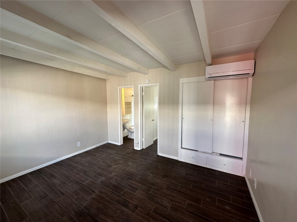 1015 North Azusa Avenue, Unit 6 Azusa, CA 91702 - Photo 4 of 18 a view of an empty room with wooden floor and closet area