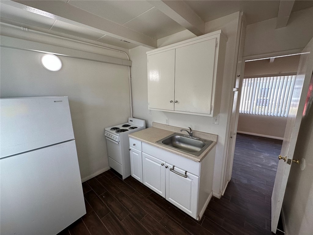 1015 North Azusa Avenue, Unit 6 Azusa, CA 91702 - Photo 8 of 18 a kitchen with sink cabinets and stove