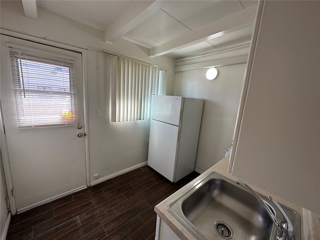 1015 North Azusa Avenue, Unit 6 Azusa, CA 91702 - Photo 10 of 18 a bathroom with a sink and a large mirror