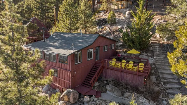 front view of a house with a tree