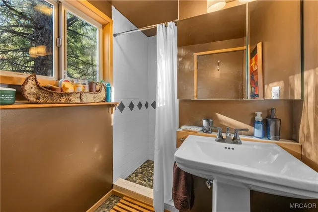 a bathroom with a sink and a mirror