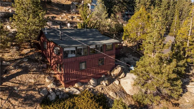 a view of a house with a tree