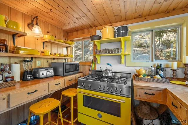 a kitchen with a sink and a stove top oven