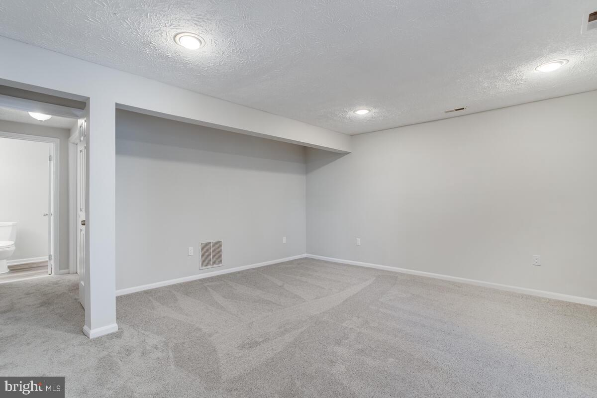 1308 Apple Ridge Court Edgewood, MD 21040 - Photo 27 of 38 an empty room with a natural light