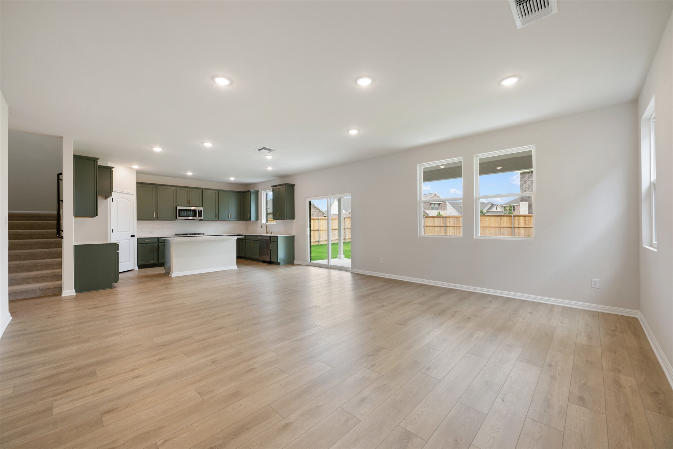 1832 Fannie Road Georgetown, TX 78633 - Photo 11 of 40 a view of kitchen with a sink wooden floor and a large window
