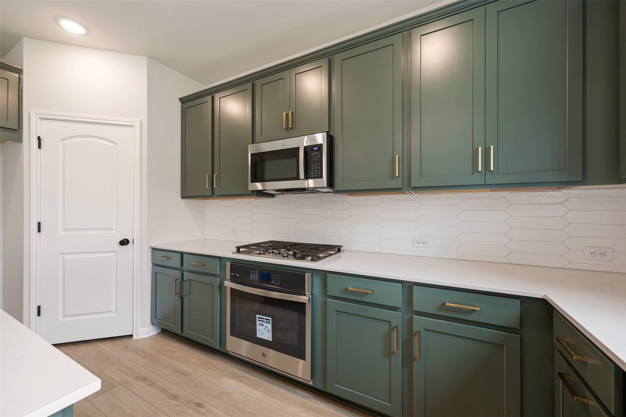 1832 Fannie Road Georgetown, TX 78633 - Photo 20 of 40 a kitchen with stainless steel appliances white cabinets and a stove top oven