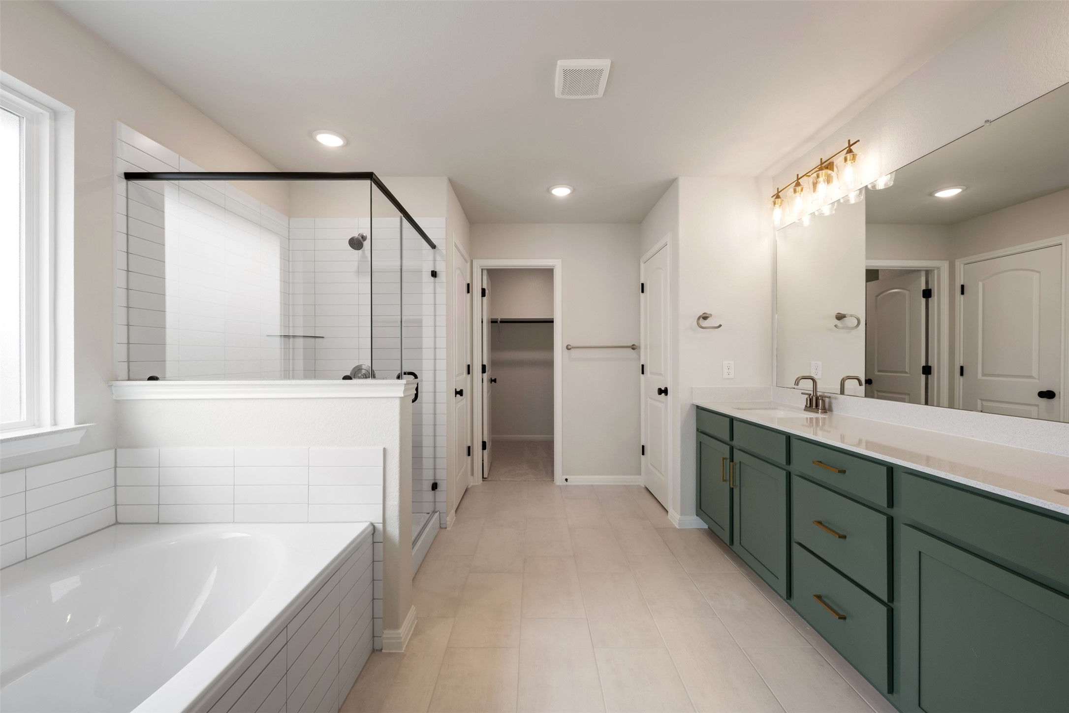 1832 Fannie Road Georgetown, TX 78633 - Photo 32 of 40 a spacious bathroom with a tub sink shower and mirror