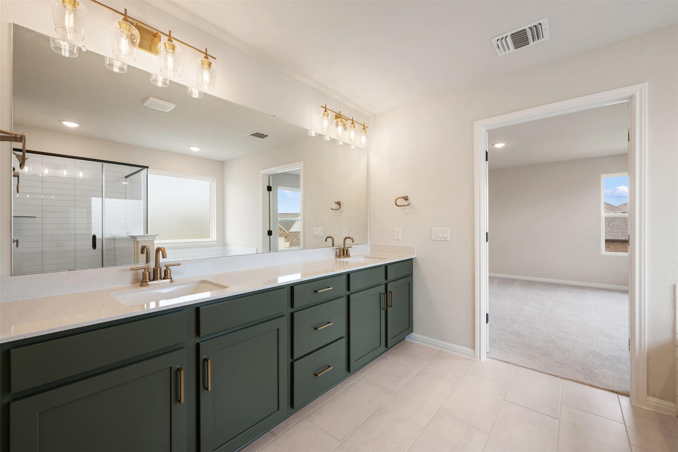 1832 Fannie Road Georgetown, TX 78633 - Photo 34 of 40 a spacious bathroom with a double vanity sink mirror and