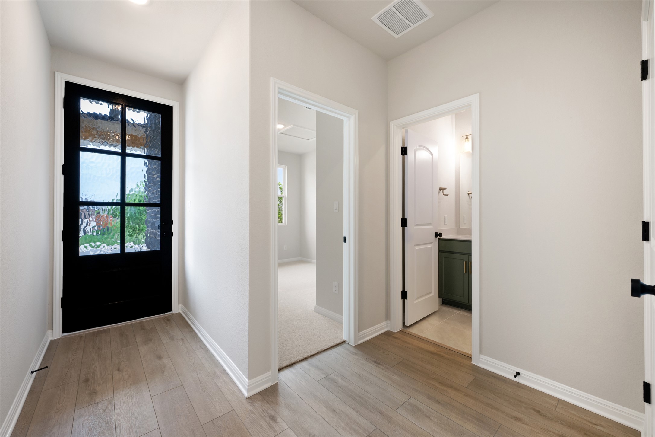 1832 Fannie Road Georgetown, TX 78633 - Photo 6 of 40 an empty room with wooden floor and windows