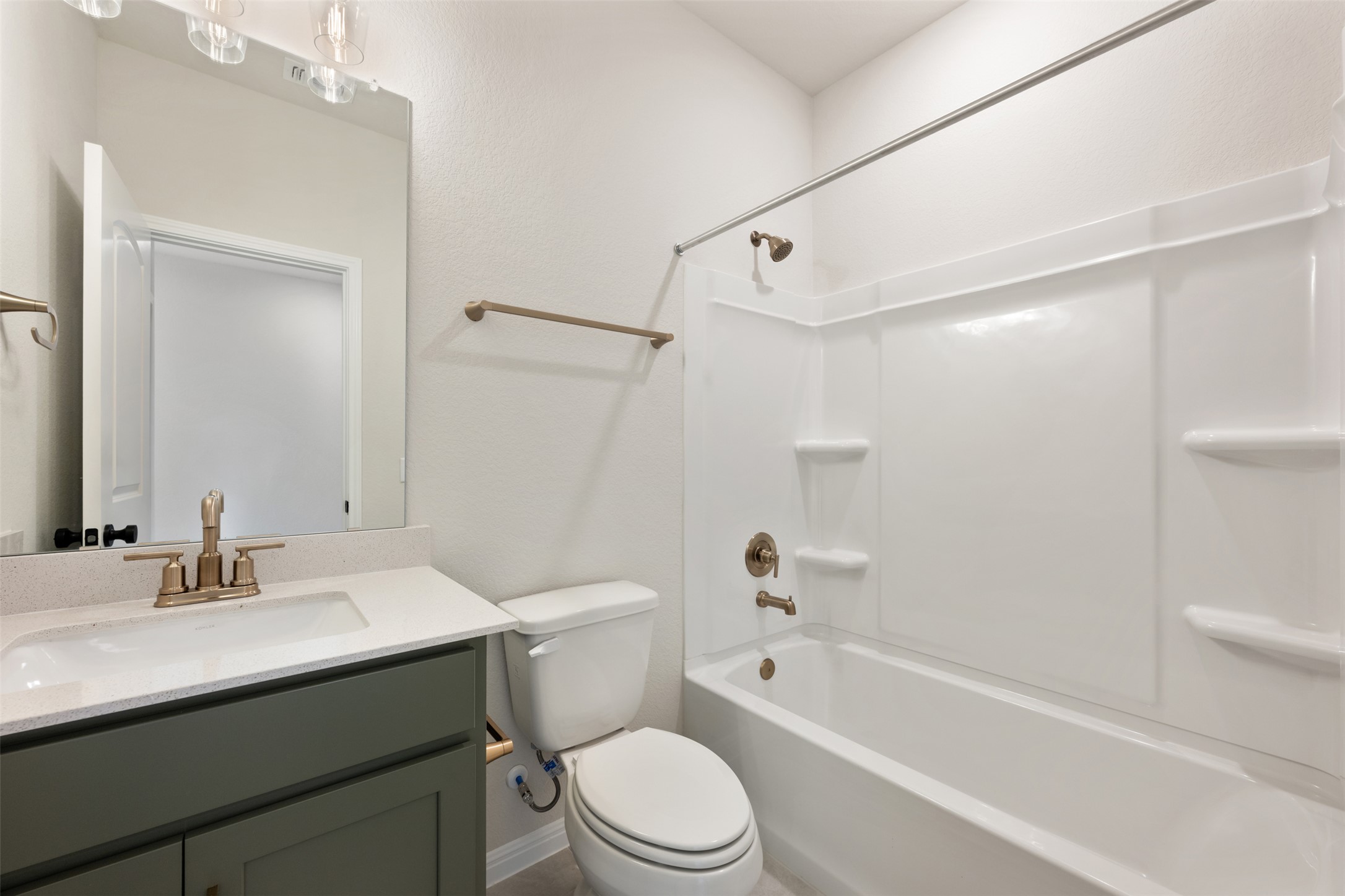 1832 Fannie Road Georgetown, TX 78633 - Photo 8 of 40 a bathroom with a sink a toilet and a bathtub