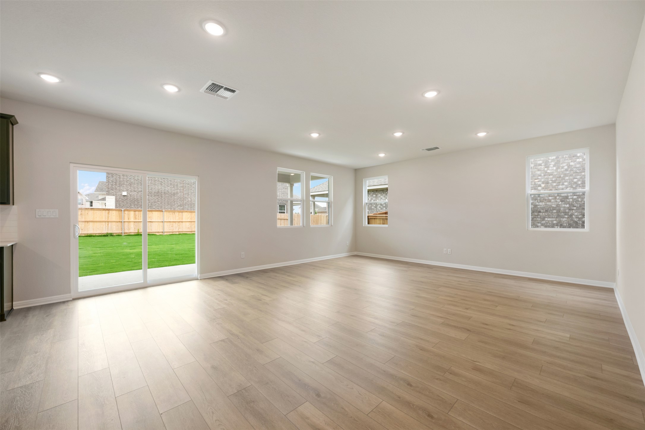 1832 Fannie Road Georgetown, TX 78633 - Photo 10 of 40 a view of an empty room with a window and wooden floor