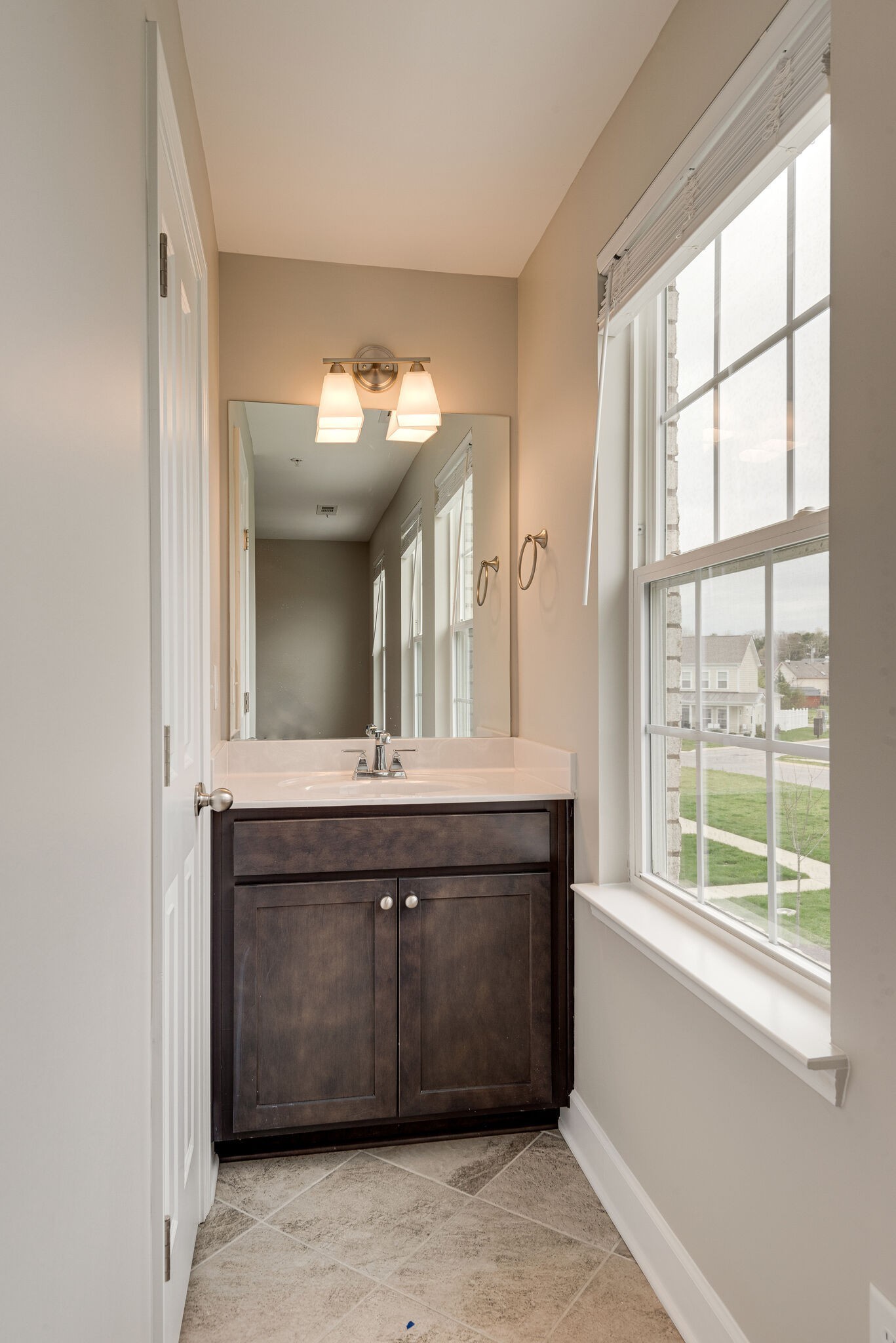 269 Mary Ann Circle Spring Hill, TN 37174 - Photo 25 of 28 a bathroom with a sink and a mirror