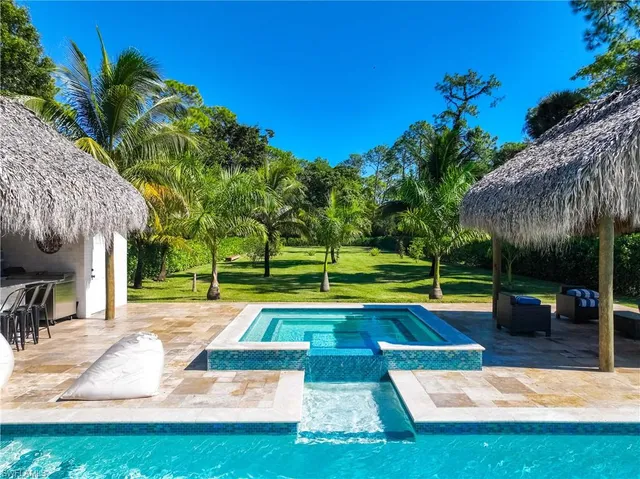 a view of a swimming pool with a patio