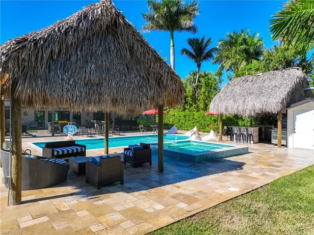 a view of backyard with swimming pool