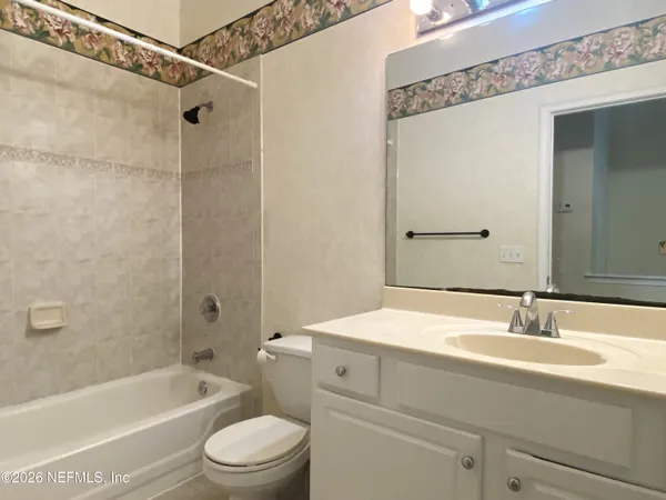 a bathroom with a sink a toilet and a bathtub
