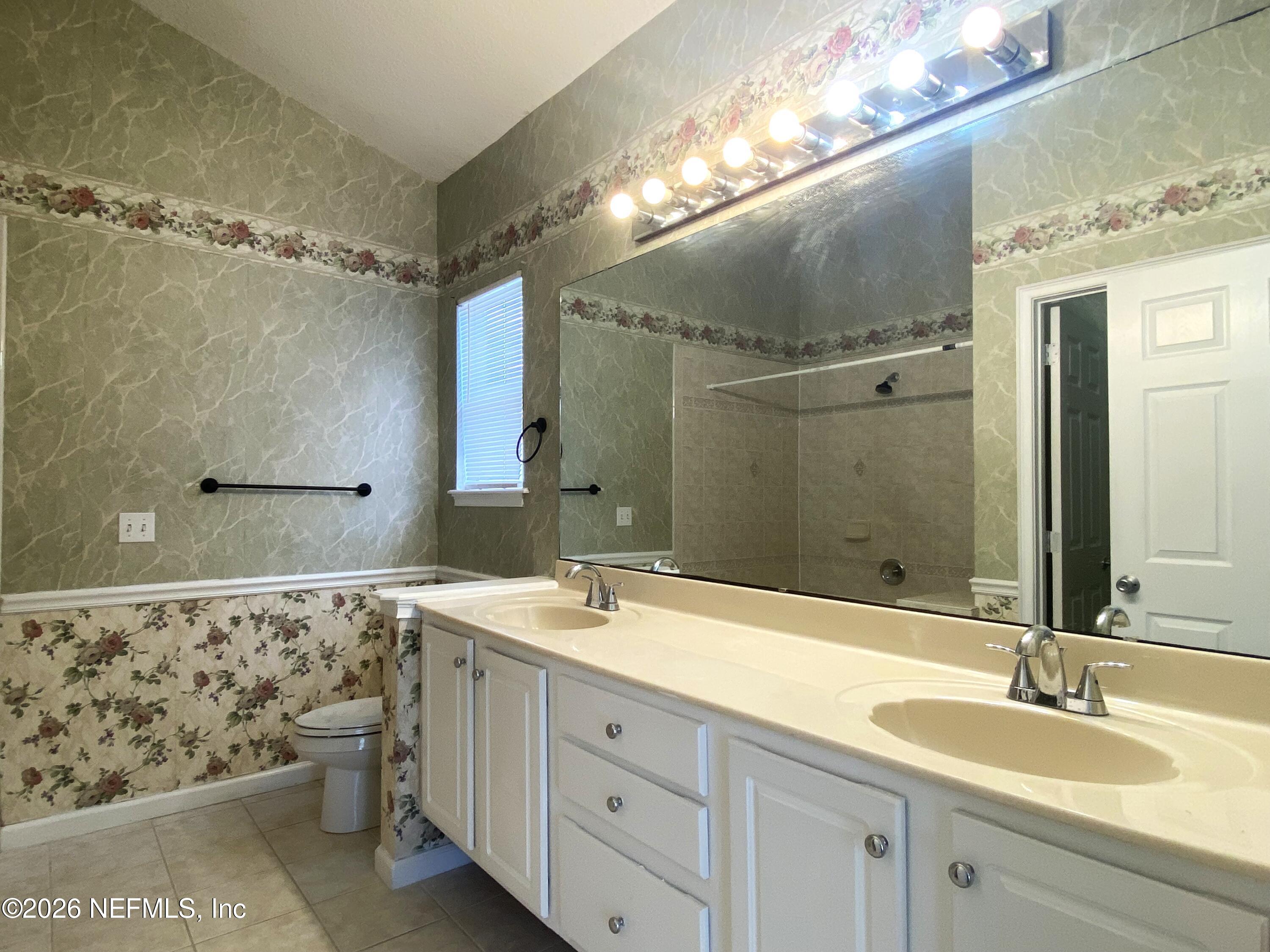 120 Seminole Road Atlantic Beach, FL 32233 - Photo 6 of 21 a bathroom with a double vanity sink mirror and double