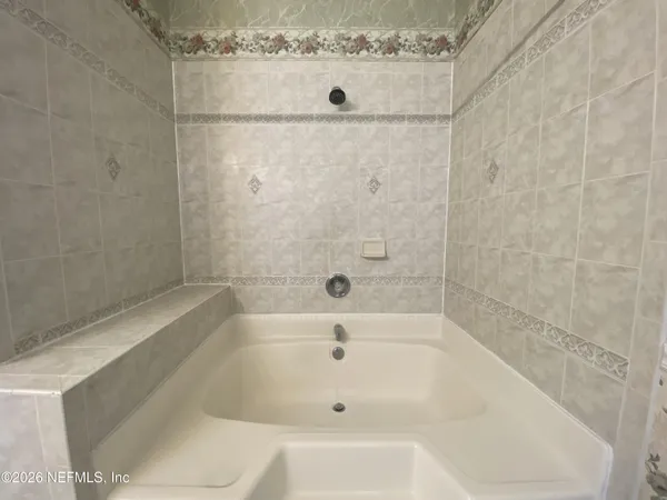a close view of a bathtub in bathroom