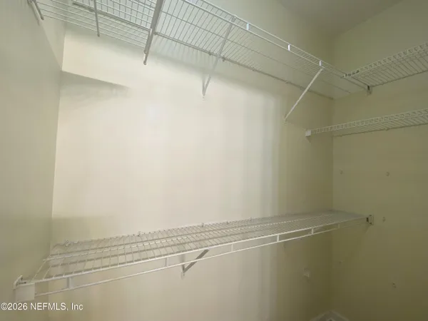 a view of a room with racks on the wall