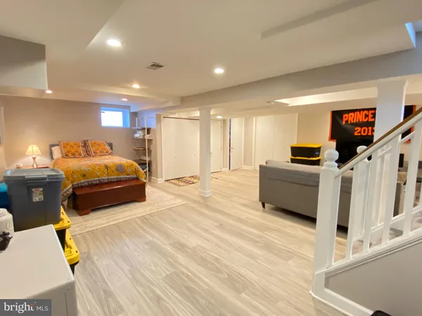 a bedroom with furniture and a flat screen tv