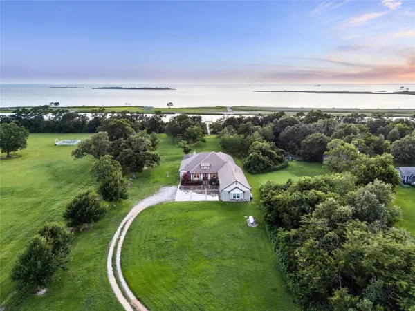 an aerial view of a golf course with parking space
