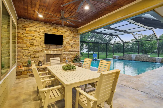 a patio with a table and chairs