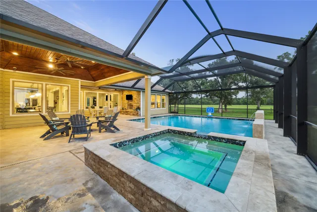 a view of a swimming pool with a patio