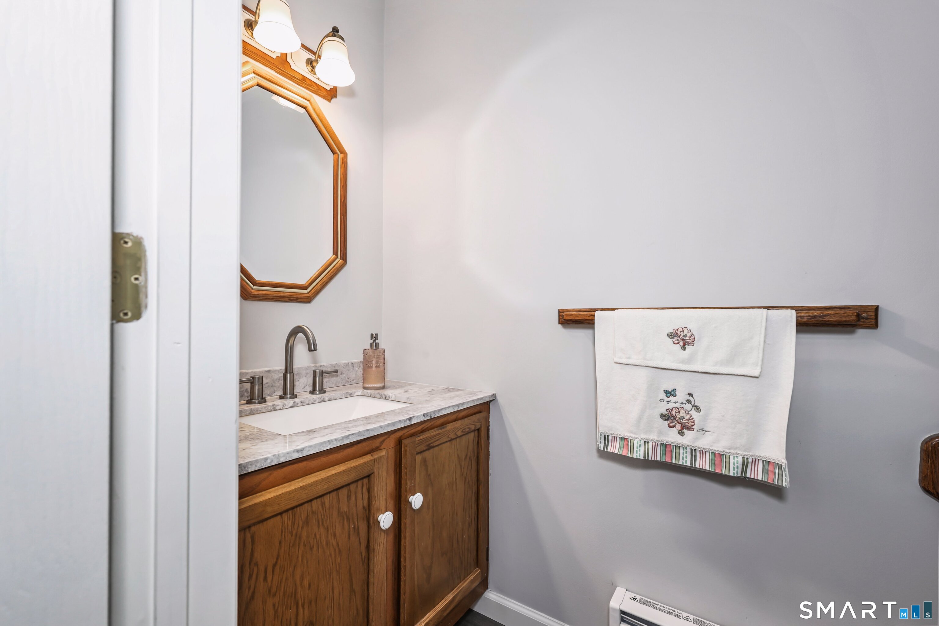 143 Pine Hill Road, Unit 5C Thomaston, CT 06787 - Photo 11 of 29 a bathroom with a sink and a mirror