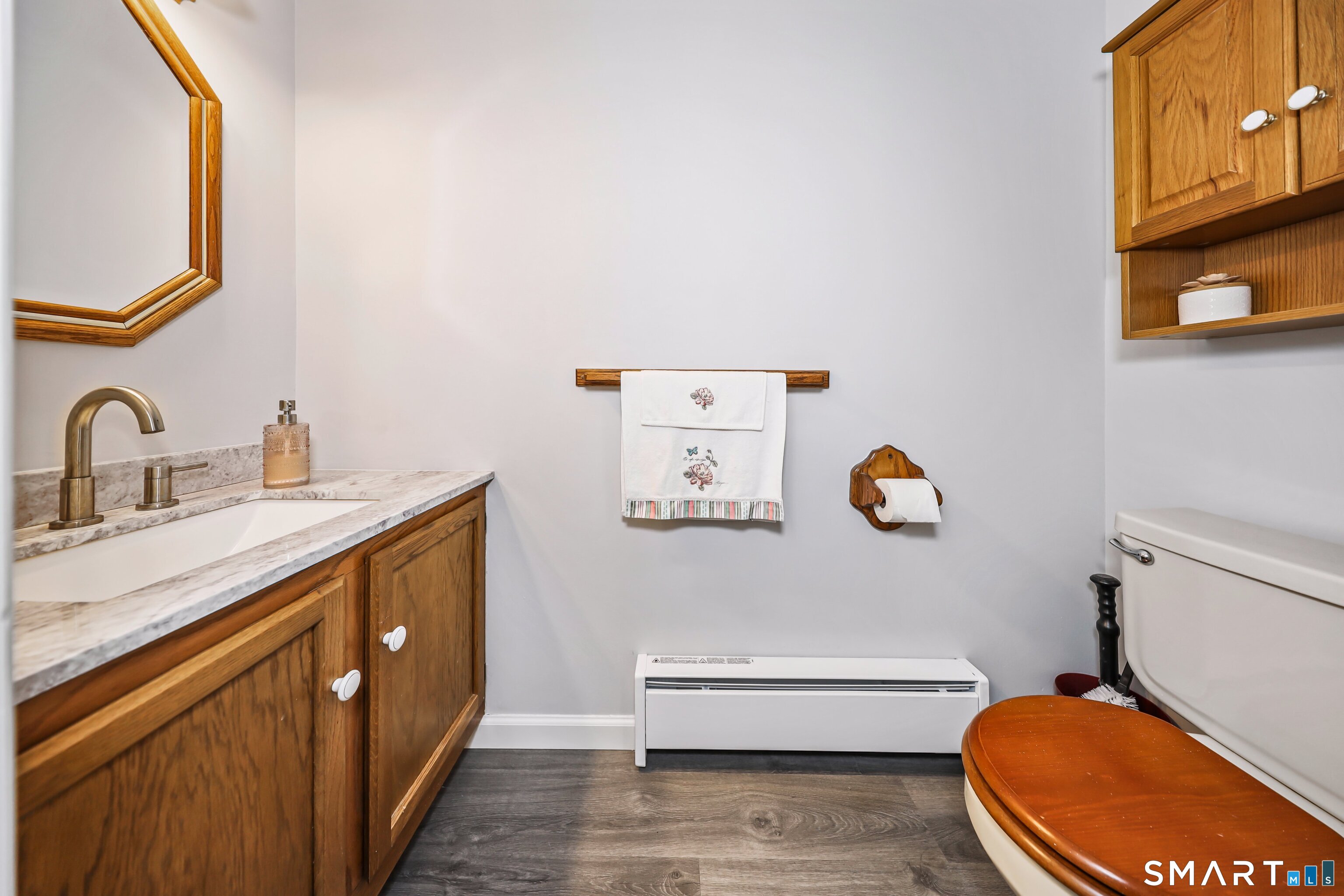 143 Pine Hill Road, Unit 5C Thomaston, CT 06787 - Photo 12 of 29 a bathroom with a sink a toilet and a mirror