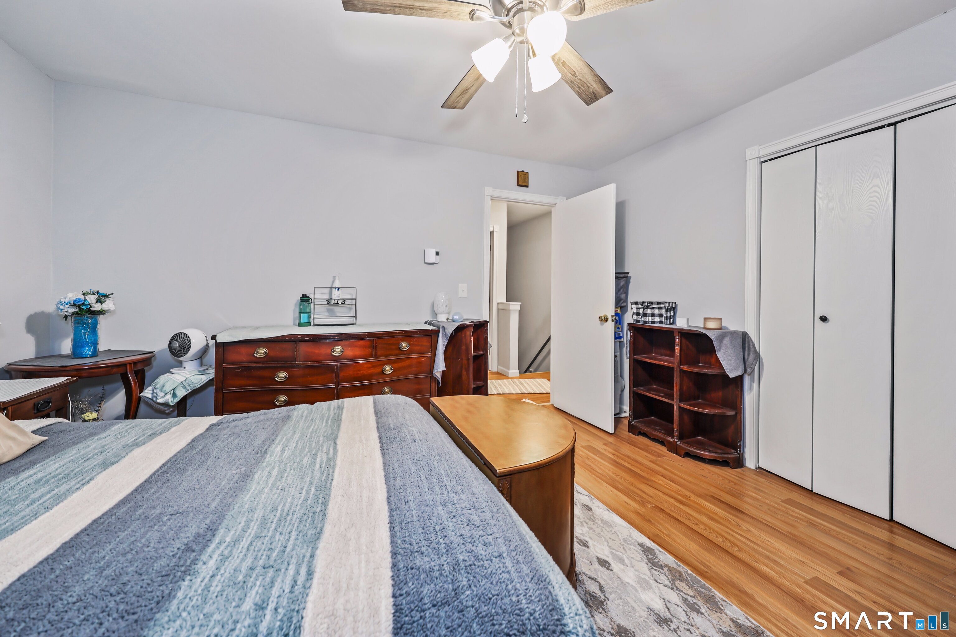 143 Pine Hill Road, Unit 5C Thomaston, CT 06787 - Photo 19 of 29 a bed room with a bed and a chandelier