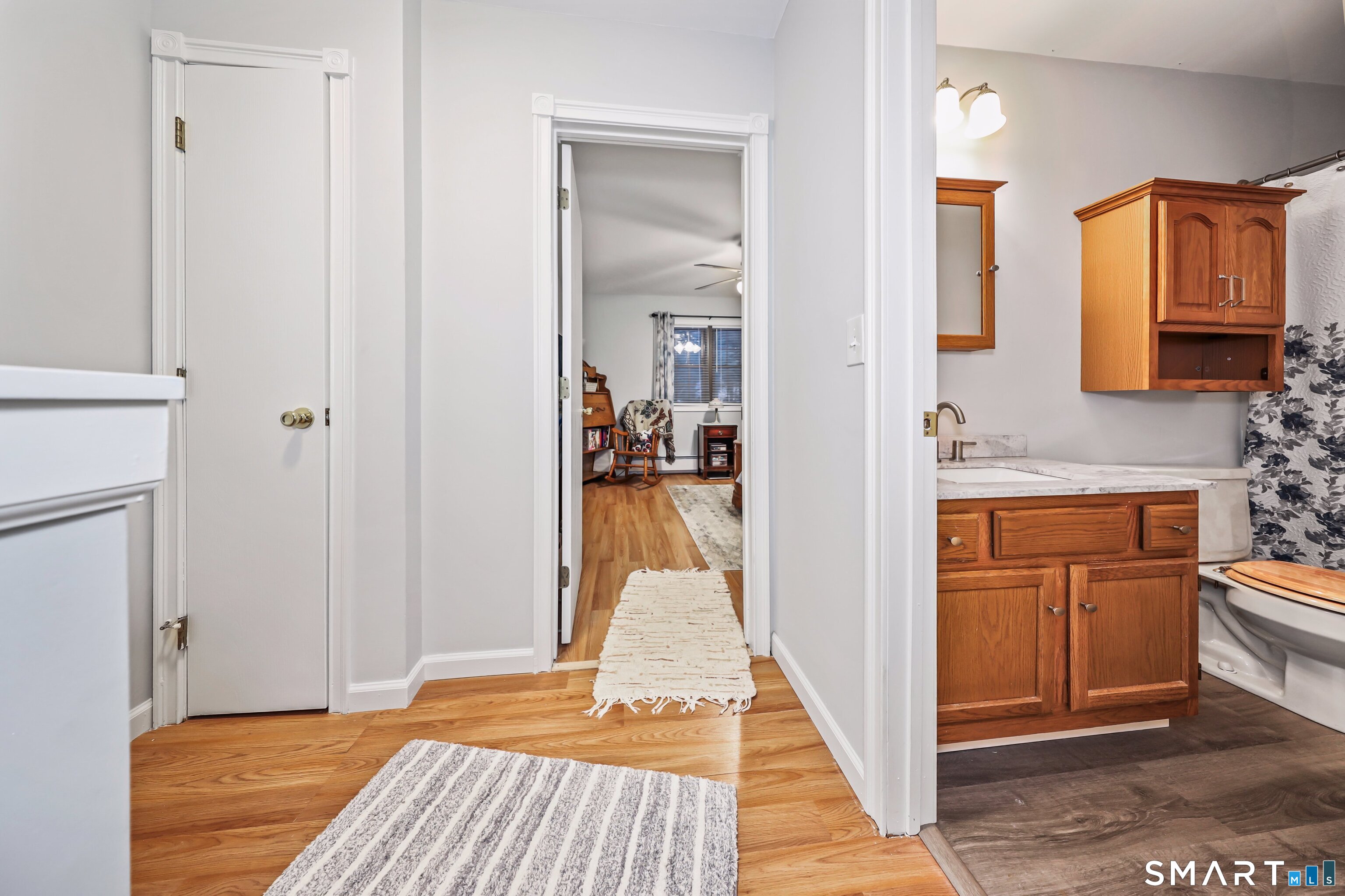 143 Pine Hill Road, Unit 5C Thomaston, CT 06787 - Photo 21 of 29 a view of a kitchen from the hallway with a sink