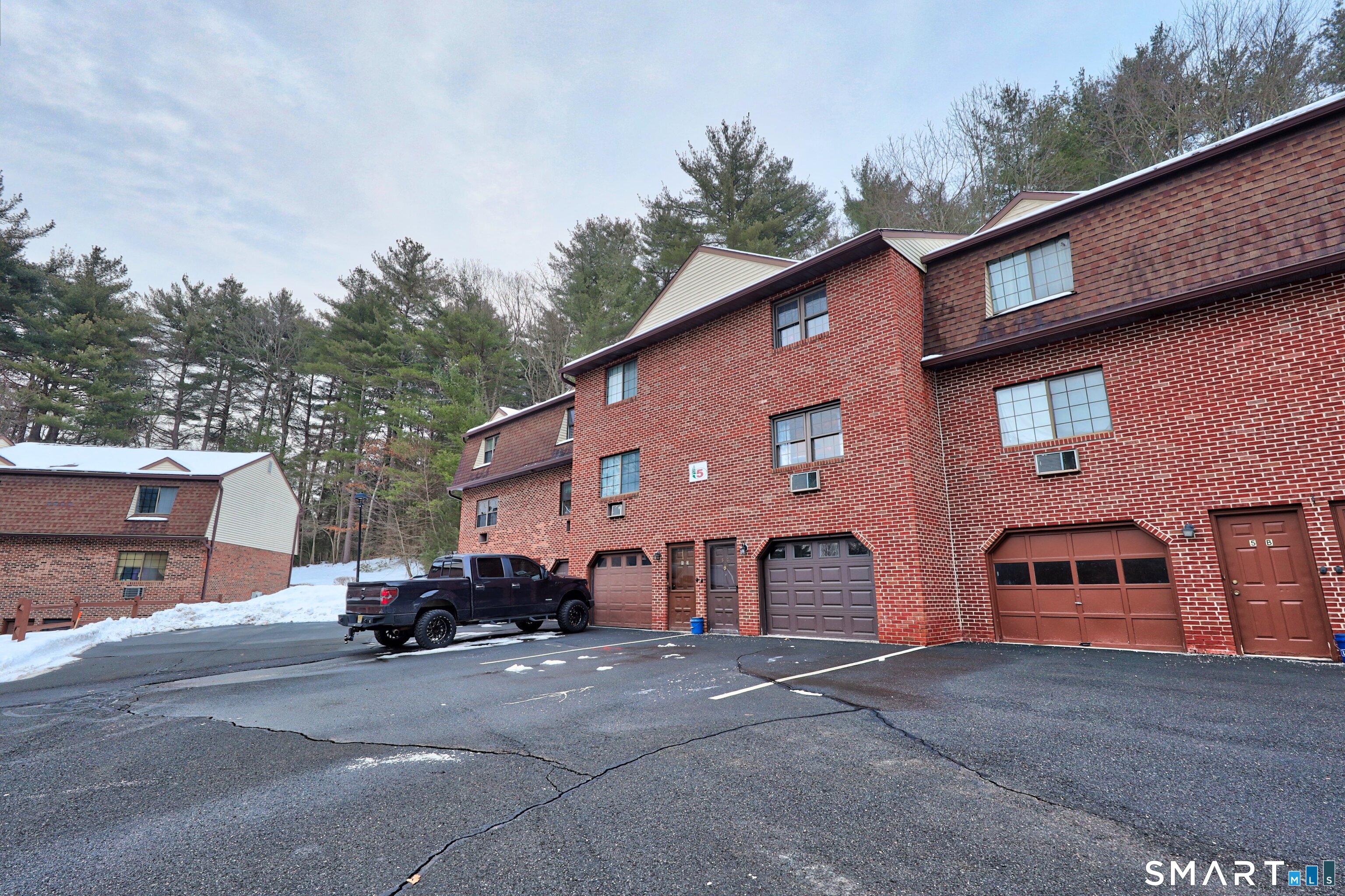 143 Pine Hill Road, Unit 5C Thomaston, CT 06787 - Photo 22 of 29 a front view of a house with a yard