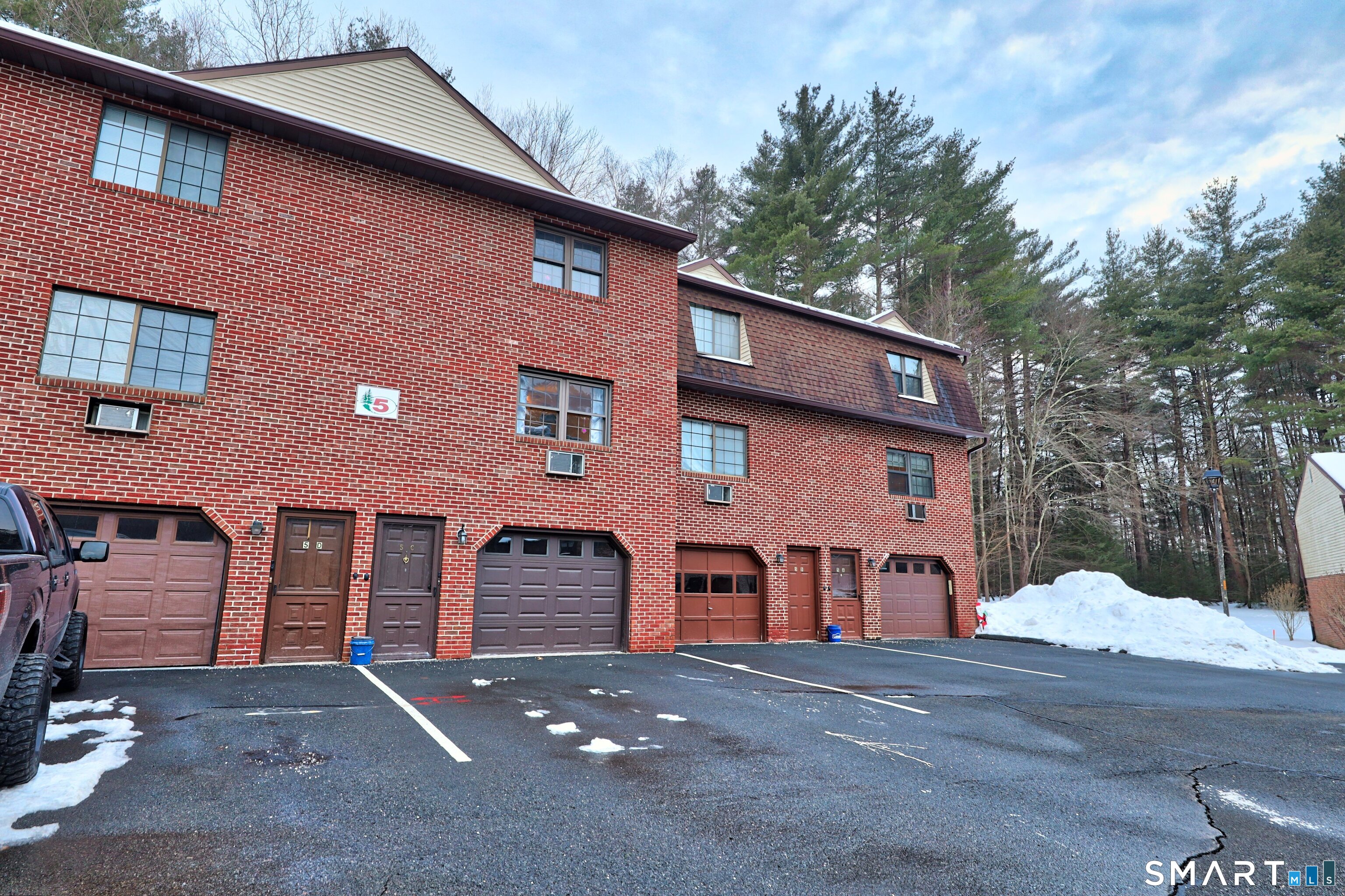 143 Pine Hill Road, Unit 5C Thomaston, CT 06787 - Photo 23 of 29 a front view of a house with a yard