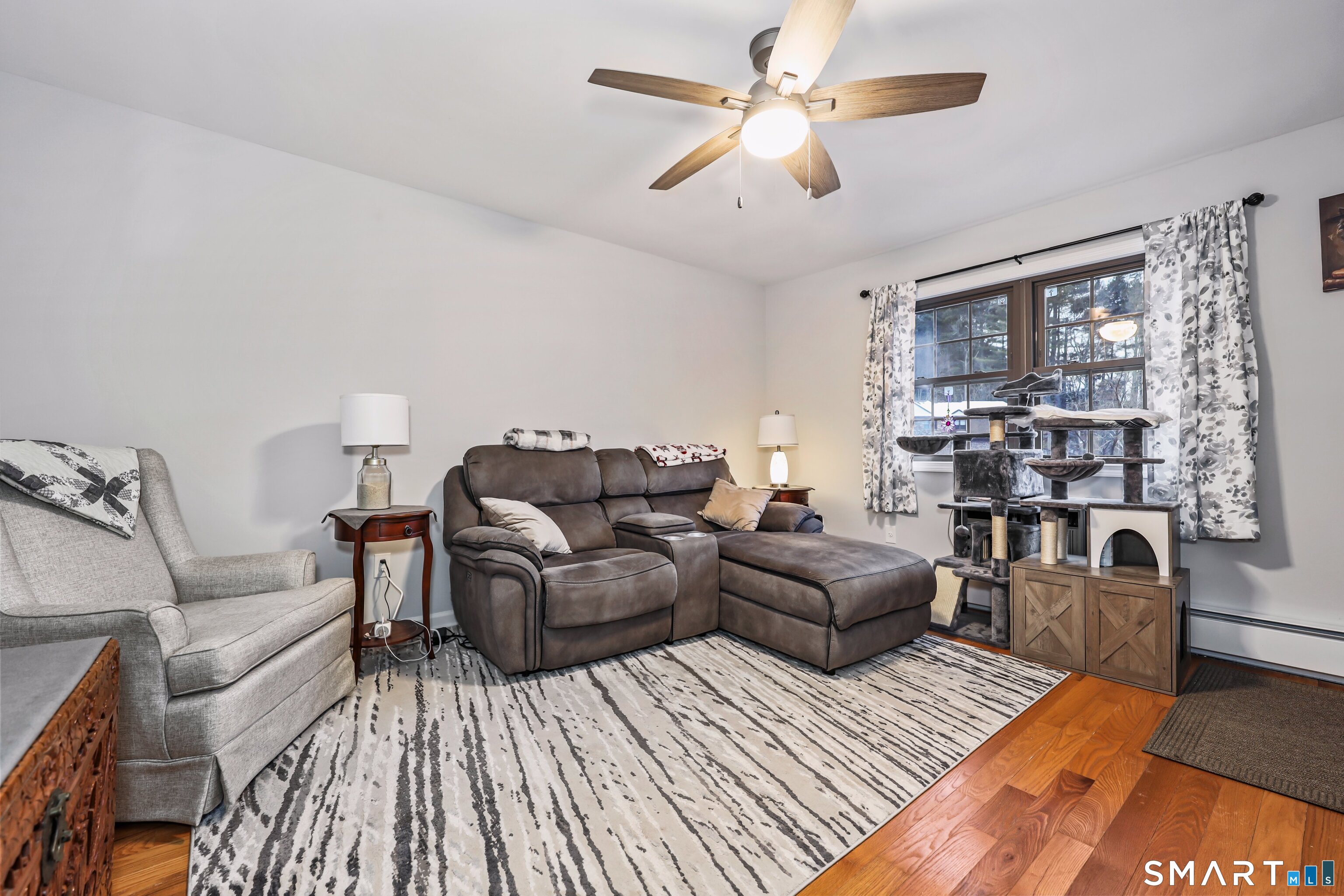 143 Pine Hill Road, Unit 5C Thomaston, CT 06787 - Photo 3 of 29 a living room with furniture and a window