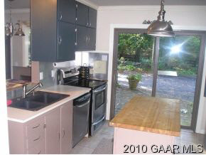 607 Augusta Farms Road Waynesboro, VA 22980 - Photo 10 of 12 a kitchen with a sink a counter top space and cabinets