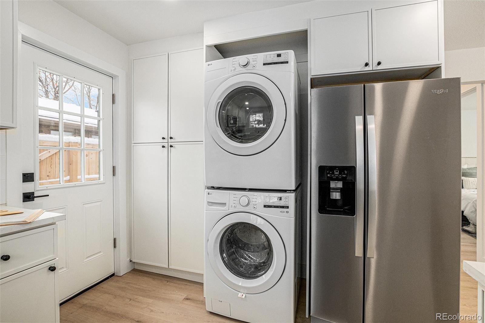 3211 Steele Street Denver, CO 80205 - Photo 12 of 26 a view of a kitchen with washer and dryer