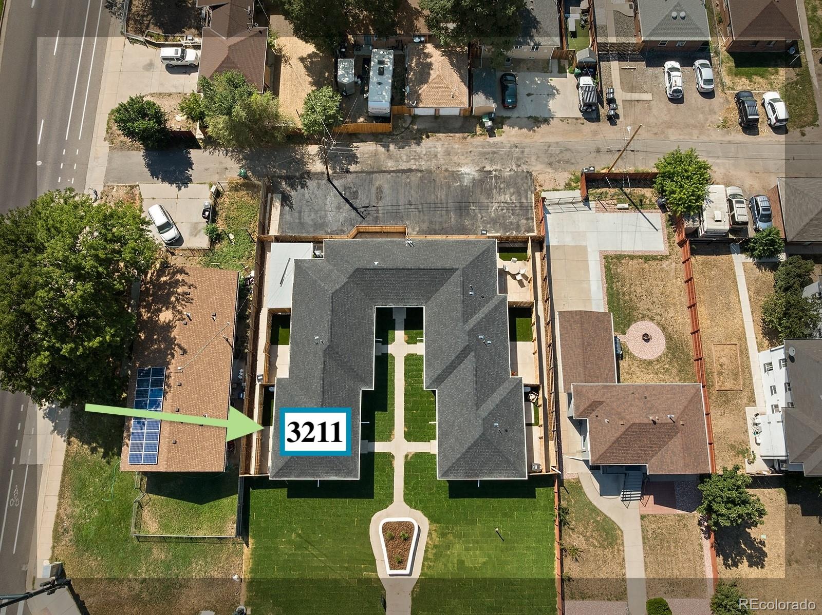 3211 Steele Street Denver, CO 80205 - Photo 7 of 26 a front view of a building with garden