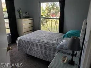 a kitchen with stainless steel appliances a refrigerator sink and microwave