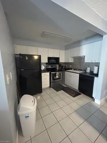 a balcony with table and chairs