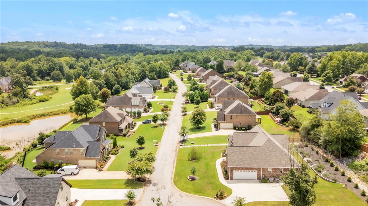 1015 Winmar Drive Anderson, SC 29621 - Photo 44 of 49 An aerial view showcases a vibrant community with houses nestled alongside a scenic golf course and pond.