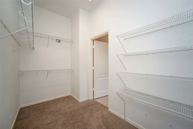 a view of an empty walk in closet