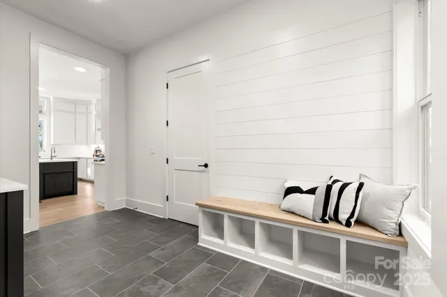 a kitchen with granite countertop cabinets and window