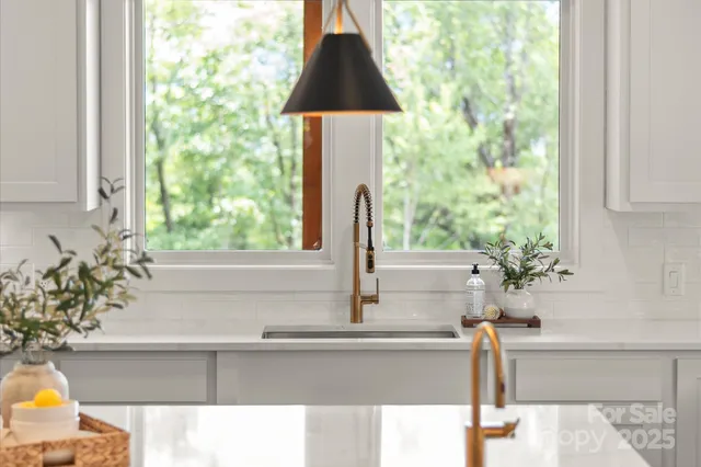 a kitchen with a table chairs stove and kitchen island