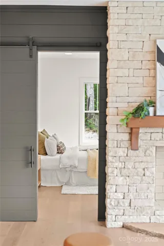 a bed sitting in a bedroom next to a window