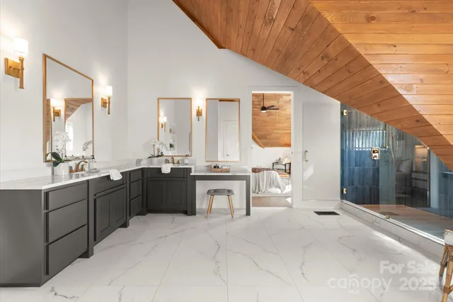 a room with a couch and a potted plant