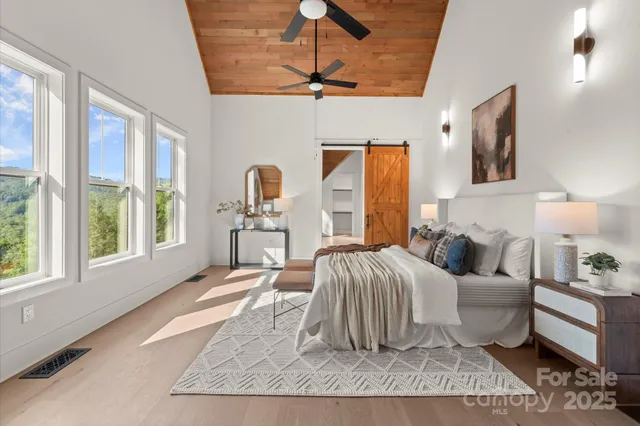 a bedroom with furniture and a window